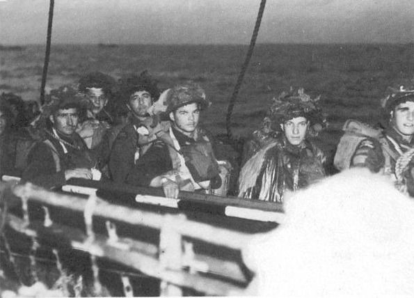 Troops of the Régiment de la Chaudière, 8th Brigade, prepare to board LCA's..