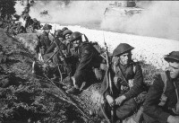 8th Canadian Infantry Brigade rest on the road to the front.