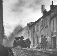 Infantry advance with  Sherman tank.